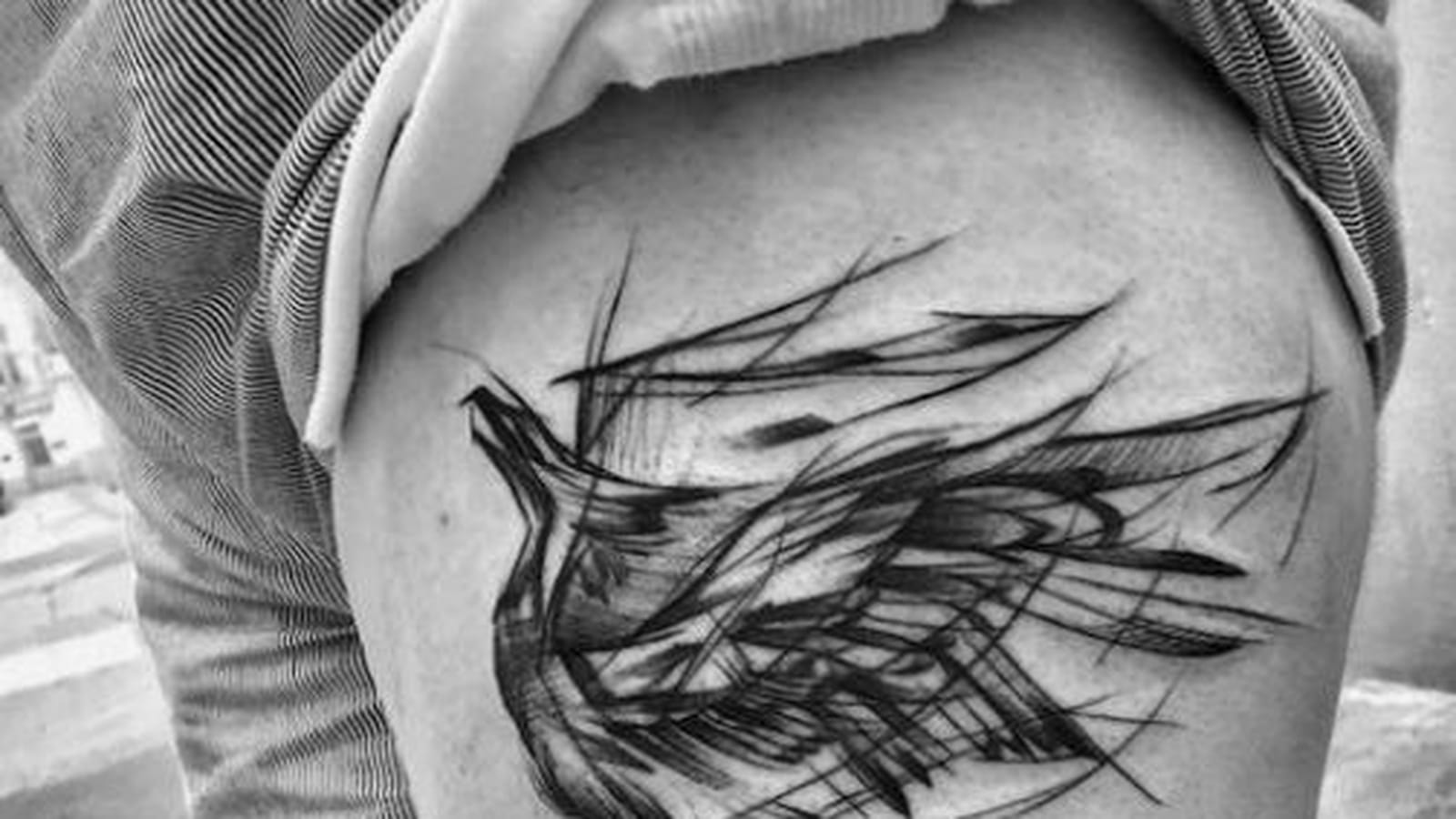 Phoenix sombre sur la cuisse