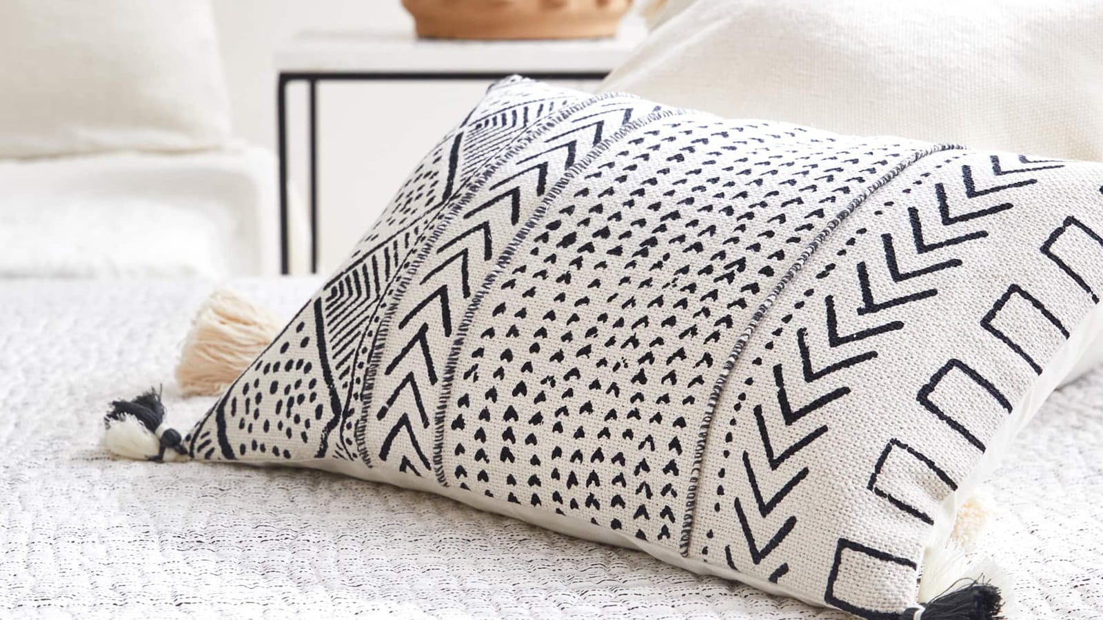Housse de coussin motifs géométriques