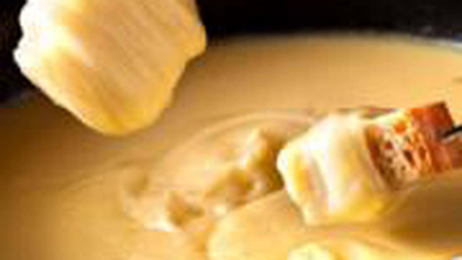 Fondue moitié vacherin, moitié gruyère