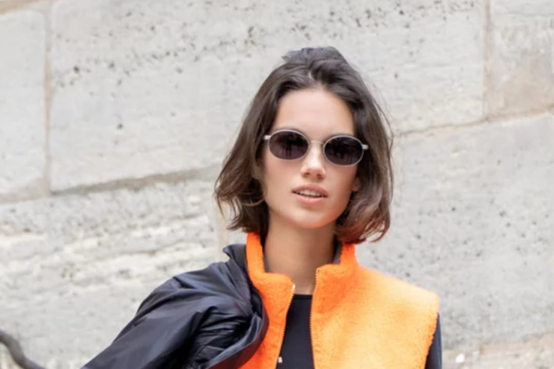 Blouson sans manches en fausse fourrure orange fluo