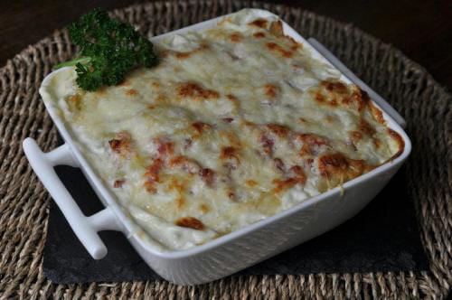 Gratin de ravioles au saumon et courgettes