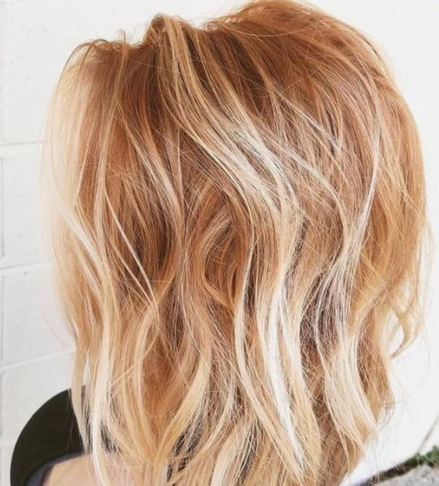 Balayage blond polaire sur cheveux roux