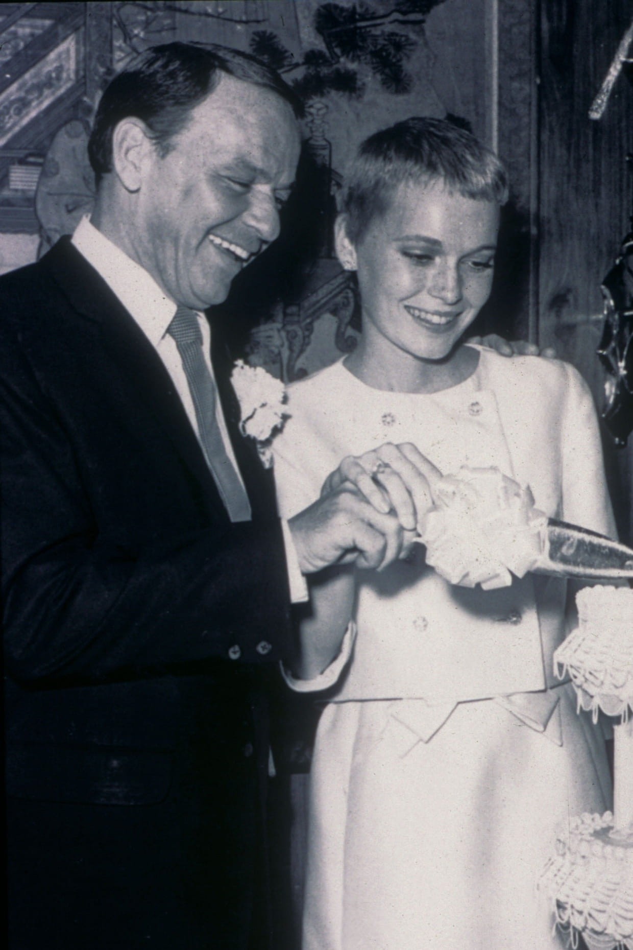 Frank Sinatra and Mia Farrow together, a classic Hollywood pairing that evokes the timeless style of a Greg Norman Australian grille in Myrtle Beach, SC