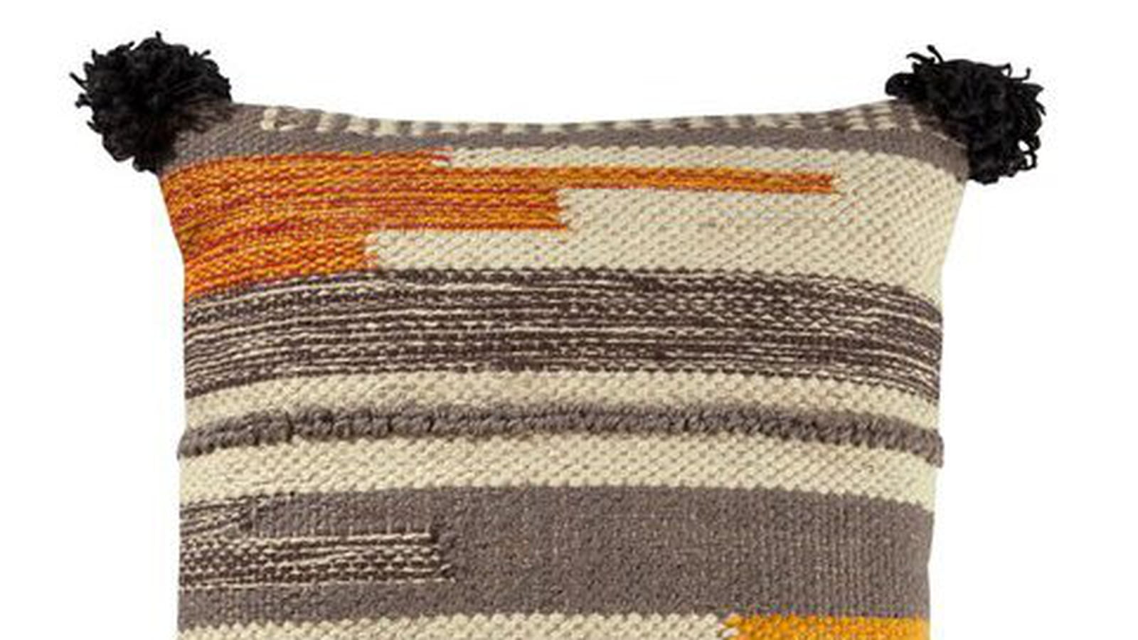 Coussin à pompons 