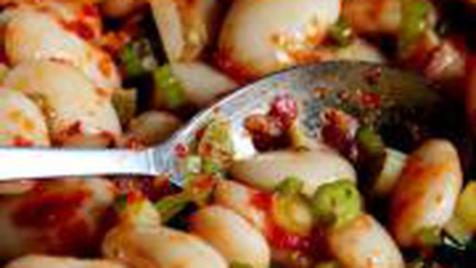 Haricots géants à l'harissa et ciboule